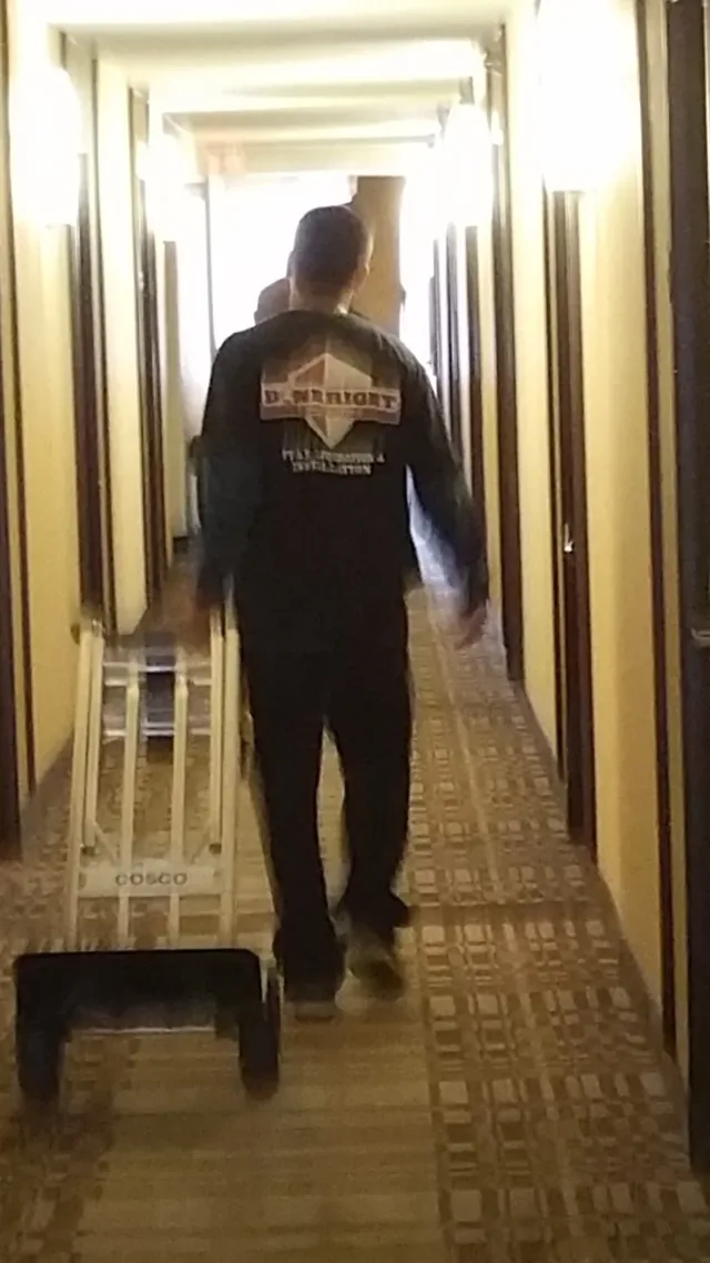Doneright crew member in hotel corridor